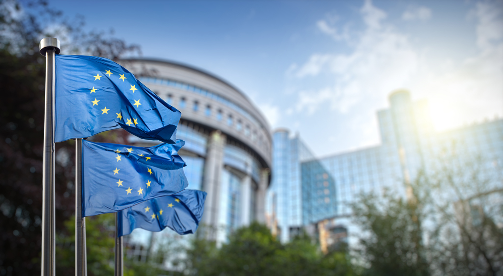 European union flag against parliament in Brussels, Belgium